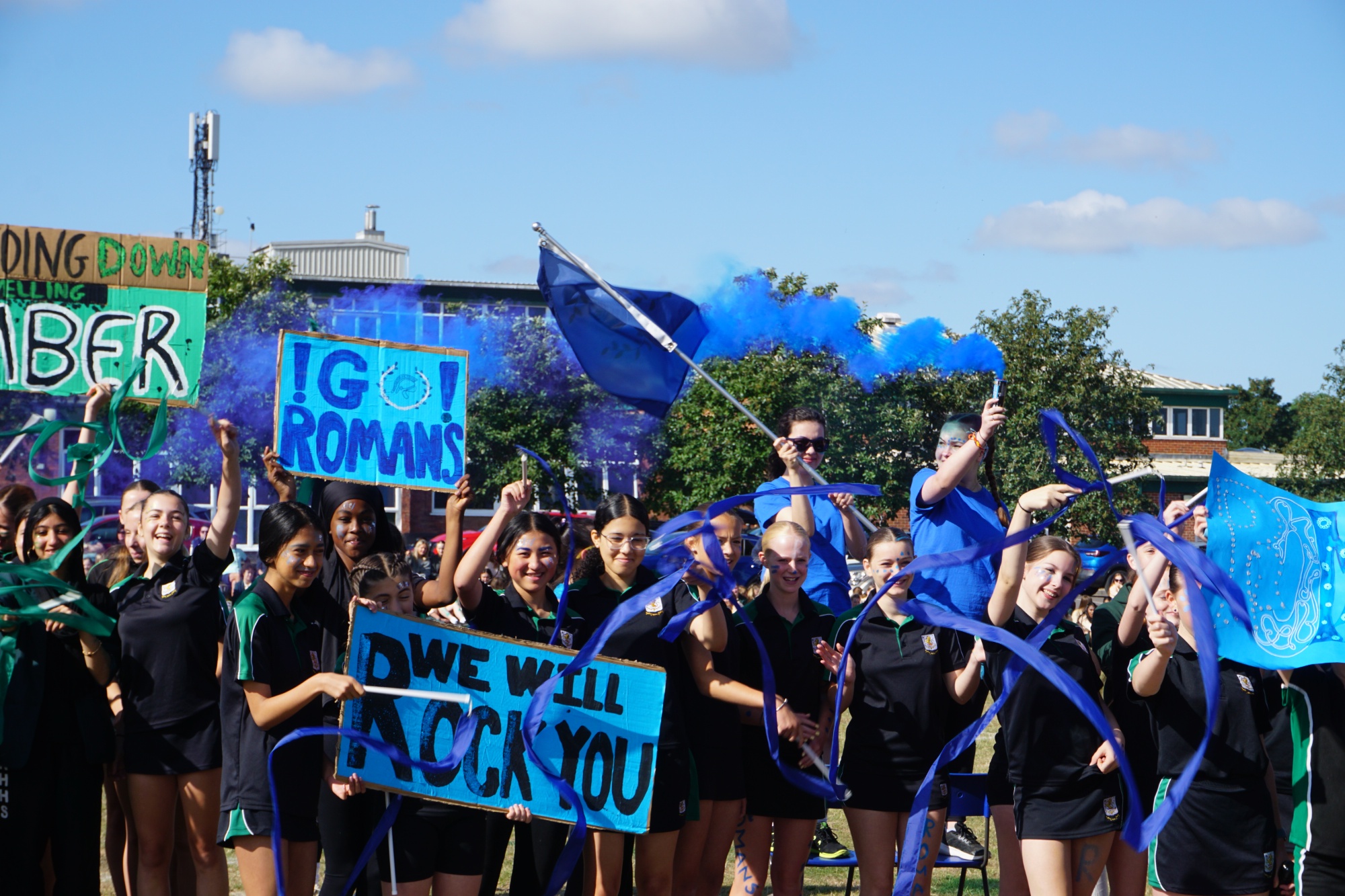 Ribston students on school field celebrating sports day. Students are from the Roman House here at Ribston.