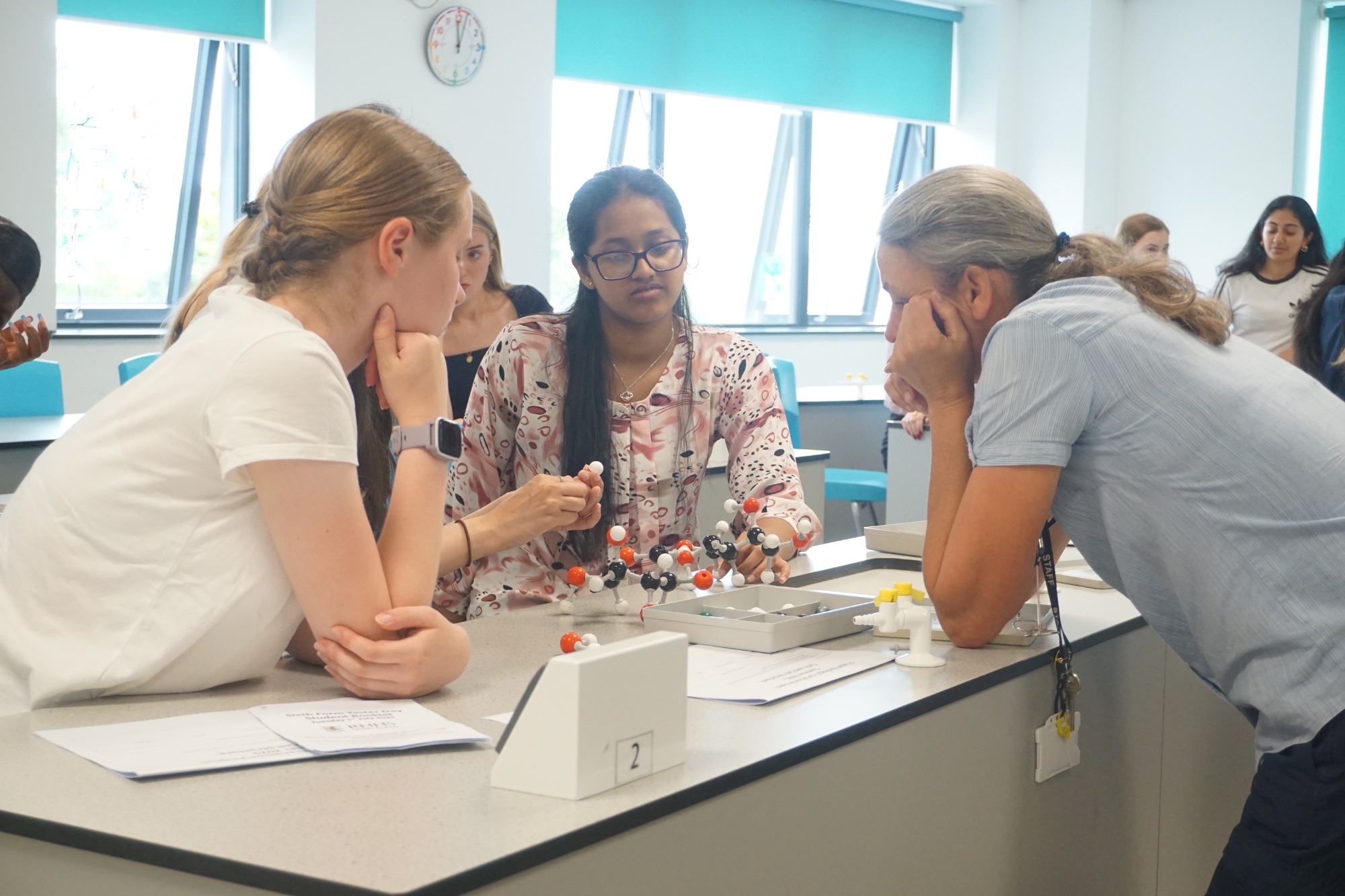 Two students and teacher in a Ribston science lesson.